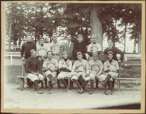 "Amateur Champions of the state of Maryland and the District of Columbia, 1895-96," taken 1896 at the fair grounds. Donated by Mrs. W.S. Nicholson. Players: Eugene Harriss, Charles Jones, [Harry] Dawson, Roger Shaw, Leonard Nicholson, Sol Rabbitt, Mr. Beard, Carey Kingdon, Mr. Hall, Mr. Claggett, Mr. Eagle, James Kelchner, Byron Kingdon.
